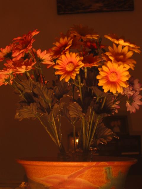 Faux flowers by candlelight